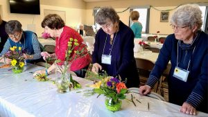 Garden club explores floral design, horseradish cultivation at potluck in Derby