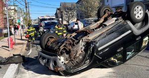 Revere police investigate after car rolls over, hits fire hydrant