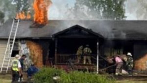 Woman rescued from house fire in Stanford