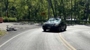 Bicyclist struck by vehicle in Lansing