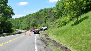 Tractor-trailer overturns in Virgil